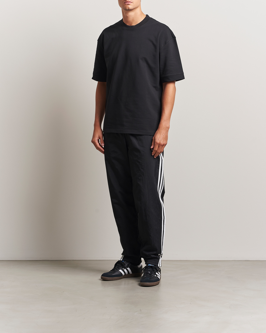 Homme | Pantalons | adidas Originals | Firebird Track Pants Black/White