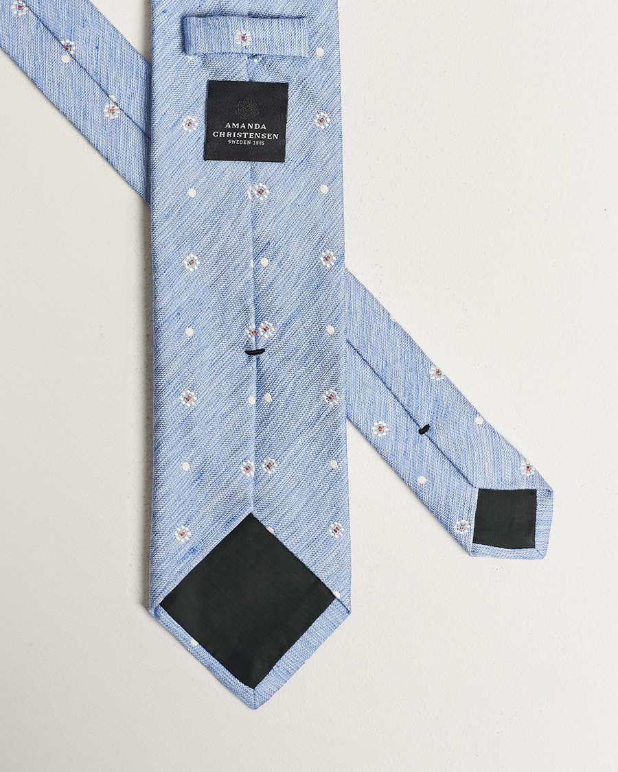 Homme | Amanda Christensen Cotton/Silk/Linen Printed Flower 8cm Tie Blue | Amanda Christensen | Cotton/Silk/Linen Printed Flower 8cm Tie Blue