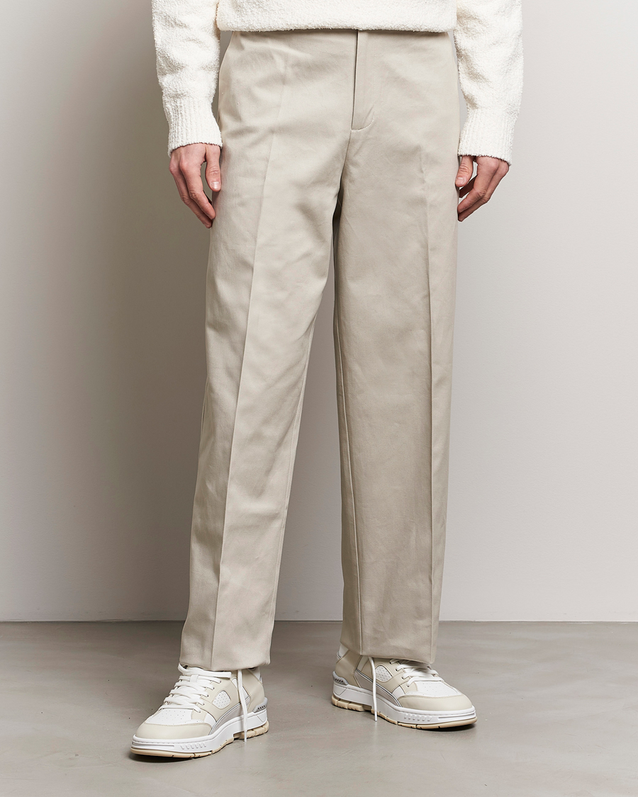 Homme | Chinos | Axel Arigato | Serif Relaxed Fit Trousers Pale Beige