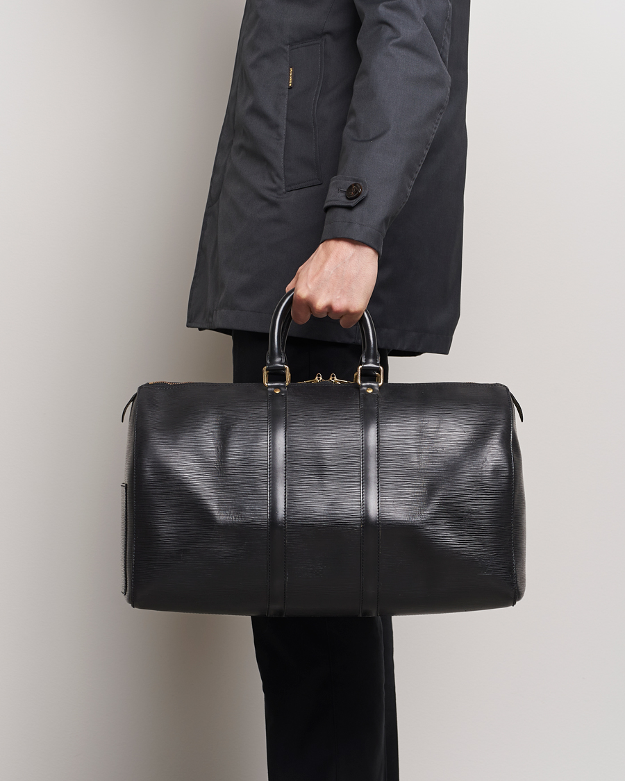 Homme | Louis Vuitton Pre-Owned Keepall 45 EPI Leather Bag Black | Louis Vuitton Pre-Owned | Keepall 45 EPI Leather Bag Black