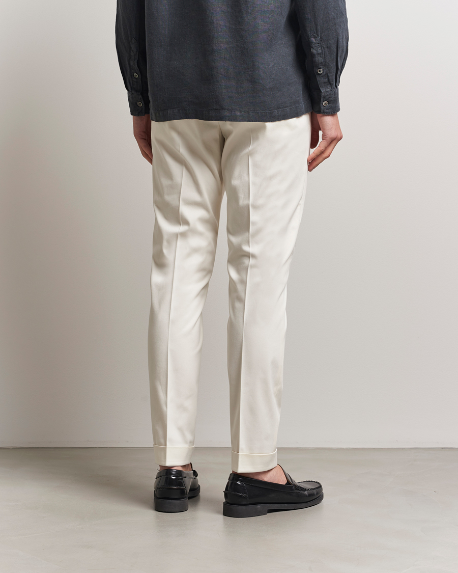 Homme | Pantalons | Tiger of Sweden | Tenuta Pleated Cotton Trousers Soft White