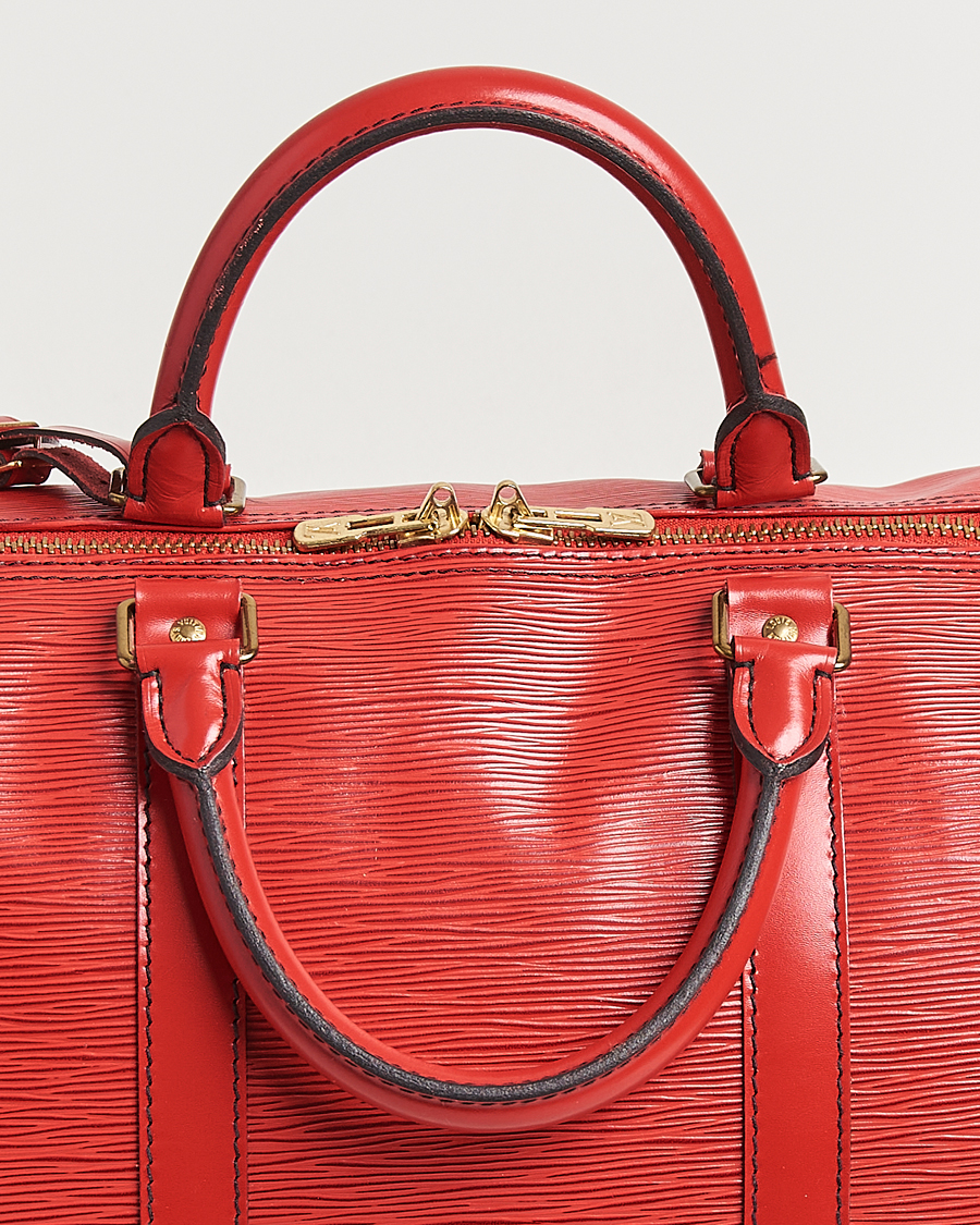 Homme | Louis Vuitton Pre-Owned Keepall 50 Epi Leather Bag Red | Louis Vuitton Pre-Owned | Keepall 50 Epi Leather Bag Red