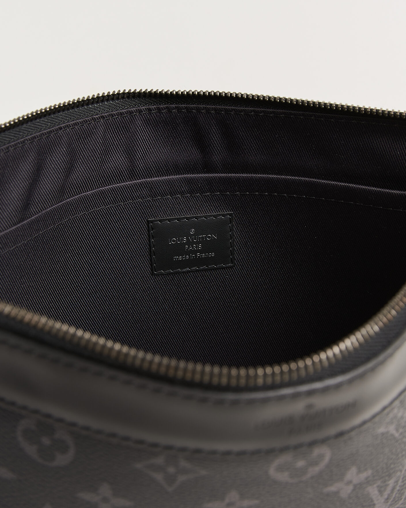 Homme | Pre-Owned & Vintage Bags | Louis Vuitton Pre-Owned | Discovery Pochette Monogram Eclipse